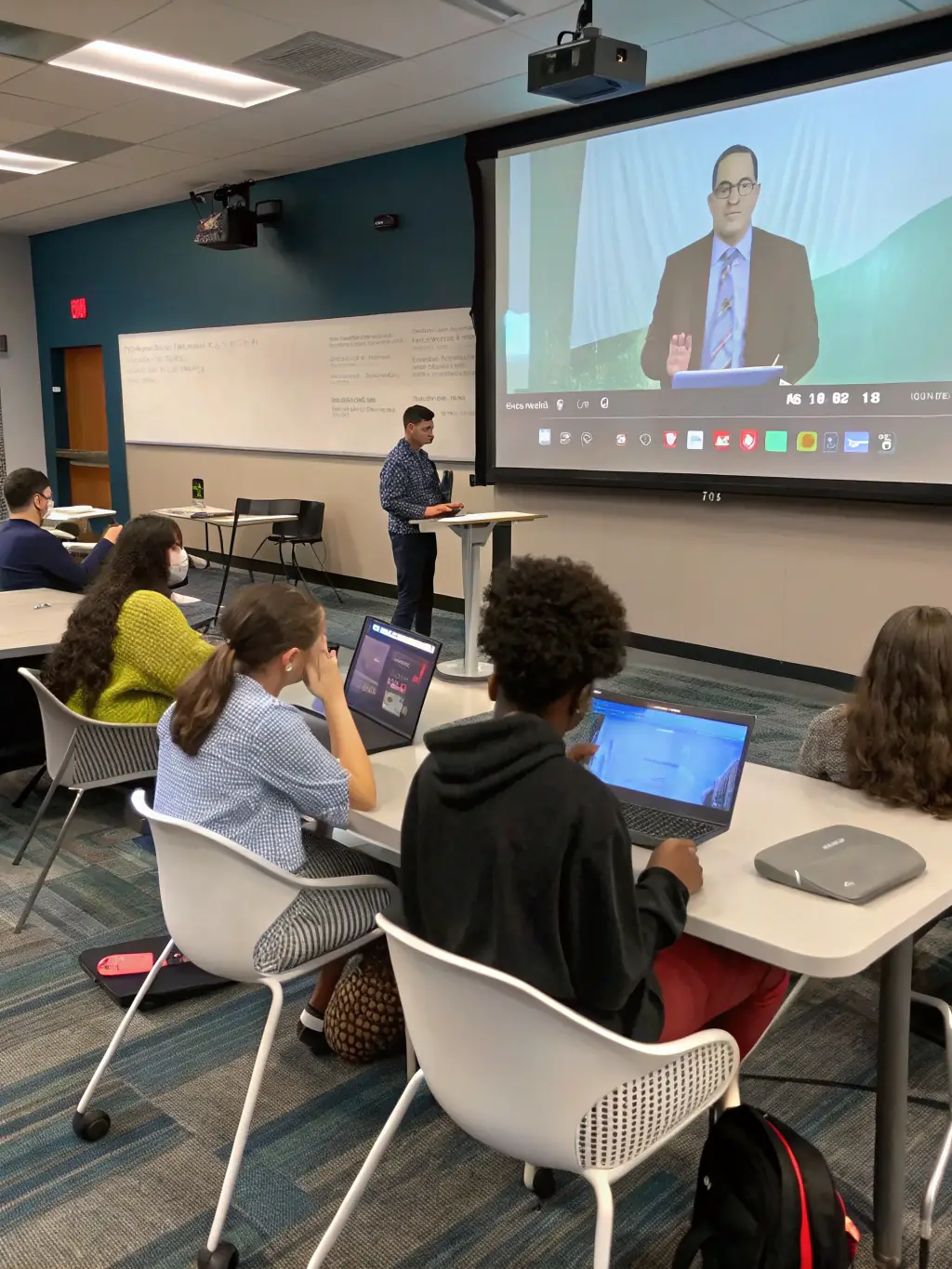 A youth minister is using a digital tablet to present an interactive lesson on biblical teachings to a group of attentive middle school students in a classroom setting.